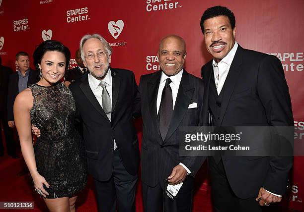 Recording artist Demi Lovato, Recording Academy and MusiCares President/CEO Neil Portnow, founder of Motown Records Berry Gordy and honoree Lionel...