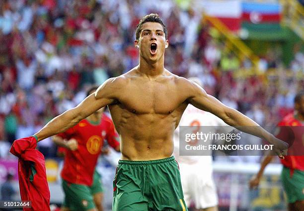 Portuguese forward Cristiano Ronaldo celebrates after scoring the opening goal, 30 June 2004 at the Alvalade stadium in Lisbon, during the Euro2004...