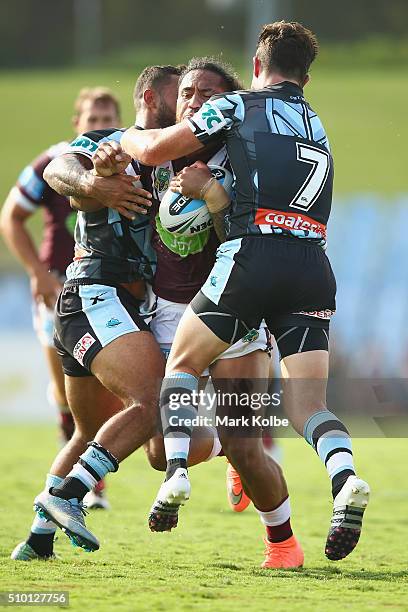 Jorge Taufua of the Eagles is tackled during the NRL Trial match between the Cronulla Sharks and the Manly Sea Eagles at Remondis Stadium on February...