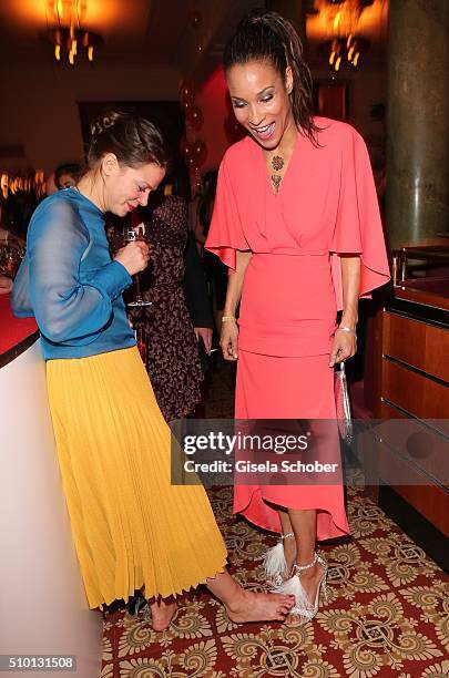 Jessica Schwarz , barefoot, and Annabelle Mandeng during the Bild 'Place to B' Party at Borchardt during the 66th Berlinale International Film...