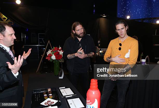 Musicians Chris Hayden and Robert Ackroyd of Florence and the Machine attend the gifting suite during the 2016 MusiCares Person Of The Year honoring...
