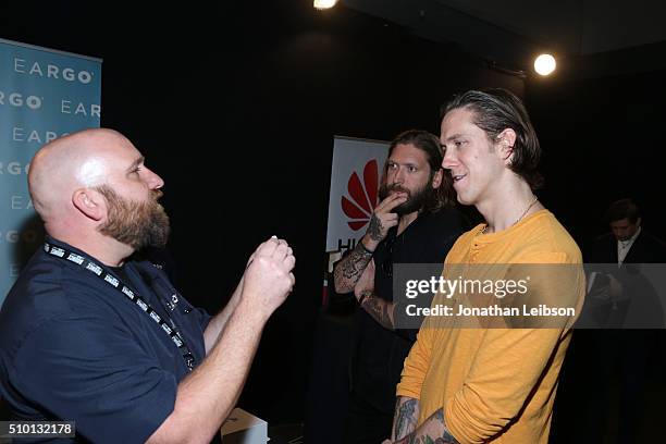 Musicians Chris Hayden and Robert Ackroyd of Florence and the Machine attend the gifting suite during the 2016 MusiCares Person Of The Year honoring...