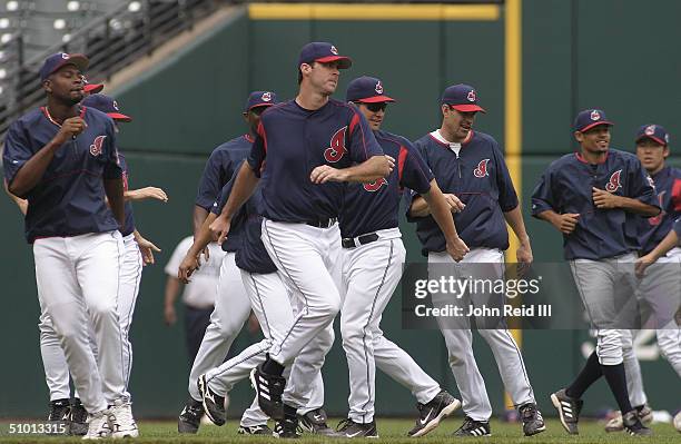 The Cleveland Indians warm up before the MLB game against the Cincinnati Reds on June 13, 2004 at Jacobs Field in Cleveland, Ohio. The Indians...