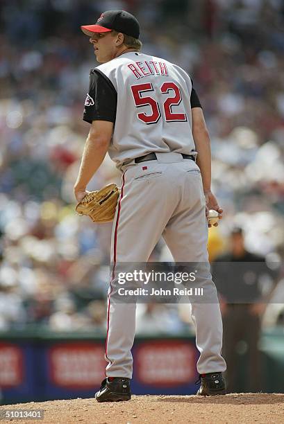 Brian Reith of the Cincinnati Reds pitches against the Cleveland Indians during the MLB game on June 13, 2004 at Jacobs Field in Cleveland, Ohio. The...