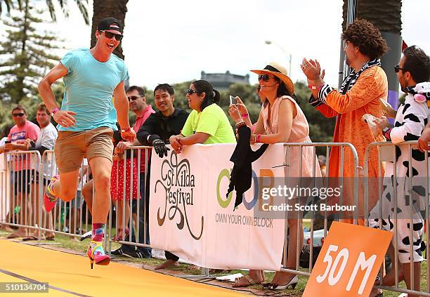 Men wearing high heeled shoes take part in a Guinness World Record attempt for the largest amount of people running in high heels on February 14,...