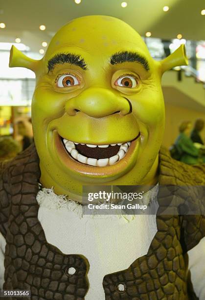 An actor in a Shrek suit attends the German premiere of "Shrek 2" on June 30, 2004 in Hamburg, Germany.