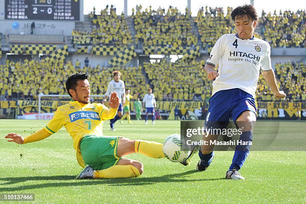 Shinnosuke Nakatani of Kashiwa Reysol and Yuto Sato of JEF United Chiba compete for the ball during the preseason friendly match between JEF United...