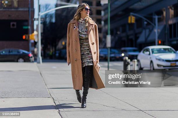 Brazilian fashion blogger Helena Bordon wearing a Zimmermann dress, a white Jimmy Choo clutch, a beige Animale Brasil wool coat, black Gianvito Rossi...