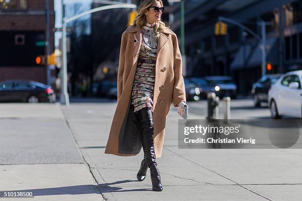 Brazilian fashion blogger Helena Bordon wearing a Zimmermann dress, a white Jimmy Choo clutch, a beige Animale Brasil wool coat, black Gianvito Rossi...