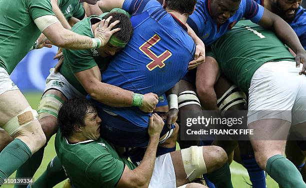 Ireland's lock Mike McCarthy tackles Frances lock Alexandre Flanquart during the Six Nations international rugby union match between France and...