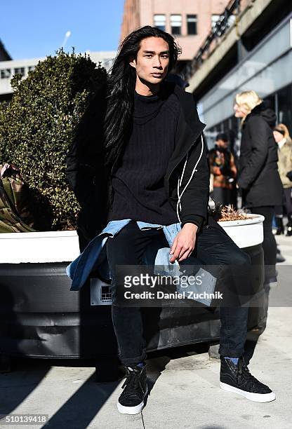 Model Alexander Dominguez is seen outside the Tibi show wearing a Control Sector jacket, DKNY sweater and Van sneakers during New York Fashion Week:...