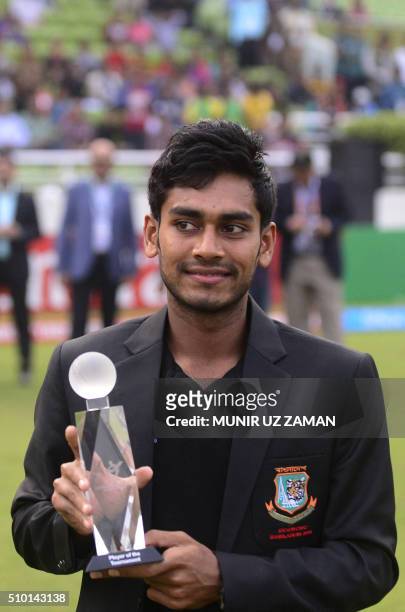 Bangladeshi cricketer Mehedi Hasan Miraz poses with the Man of the Series trophy during the presentation ceremony following the Under-19 World Cup...
