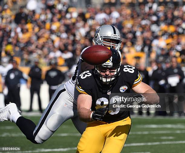 Tight end Heath Miller of the Pittsburgh Steelers is unable to catch a pass as he is pressured by linebacker Curtis Lofton of the Oakland Raiders...