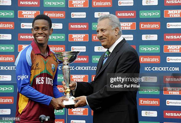 Shimron Hetmyer of West Indies U19 receives the ICC U19 World Cup trophy from ICC President Zaheer Abbas Team West Indies won the Final Match between...