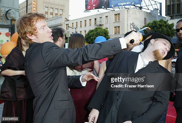 Actor Zack Ward and musician Ben Moody joke around as they arrive at the World Premiere of "LA Twister" on June 30, 2004 at the Grauman's Chinese...
