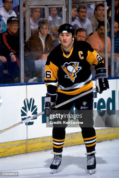 Mario Lemieux of the Pittsburgh Penguins waits behind the net during a game against the Los Angeles Kings circa 1990-91 at the Great Western Forum in...