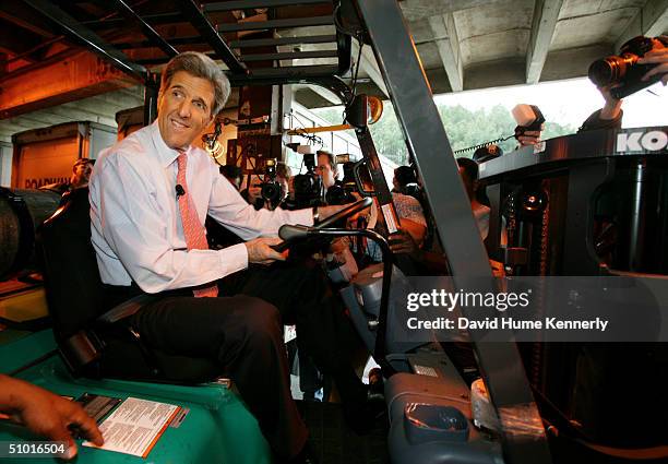 Senator John Kerry sits on a forklift as he talks to workers at Roadway Trucking March 1, 2004 in Atlanta. Georgia. Kerry defeated his Democratic...