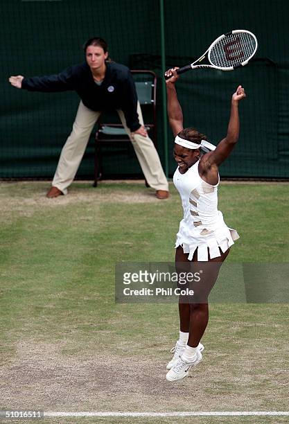 Serena Williams of USA celebrates winning her semi-final match against Amelie Mauresmo of France after Mauresmo's shot was called out at the...