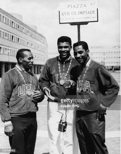 Three gold-medal winning American boxers pose in the Olympic Village, Rome, Italy, September 9, 1960. From left, Eddie Crook, Cassius Clay , and...