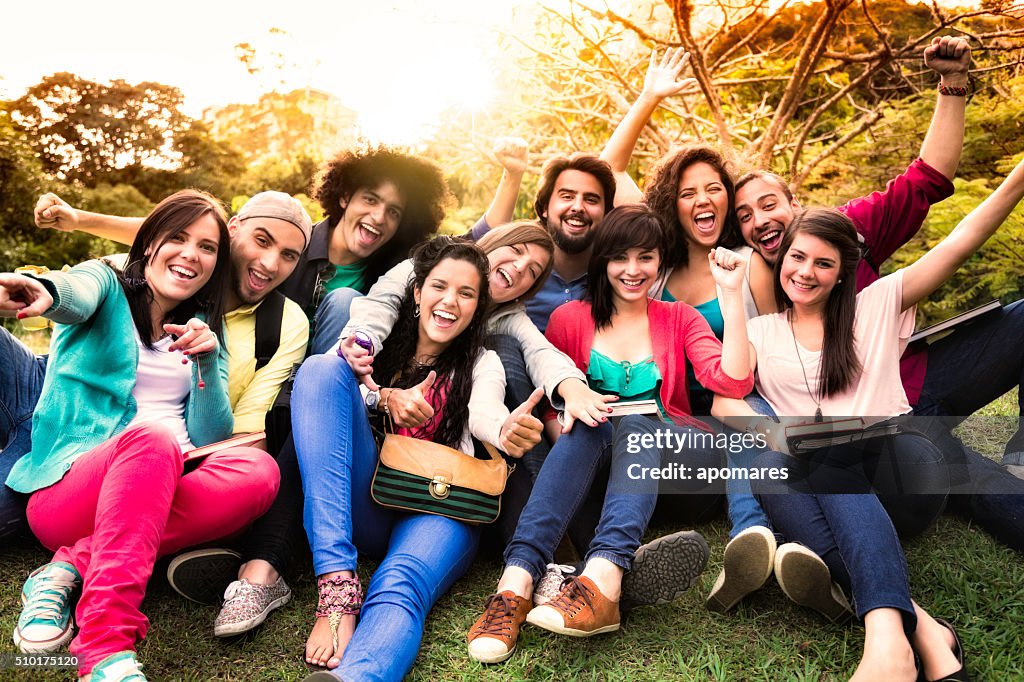 Multi-ethnic group of young students having fun at university campus