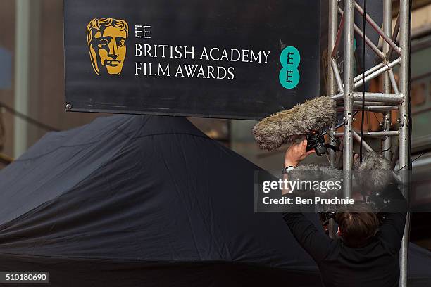 Sound engineer instals microphones ahead of the 69th EE British Academy Film Awards at The Royal Opera House on February 14, 2016 in London, England.
