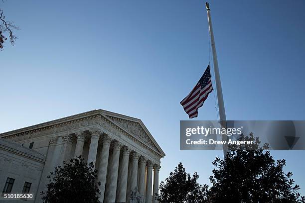 An American flag flies at half mast following the death of Supreme Court Justice Antonin Scalia at the U.S. Supreme Court, February 14, 2016 in...