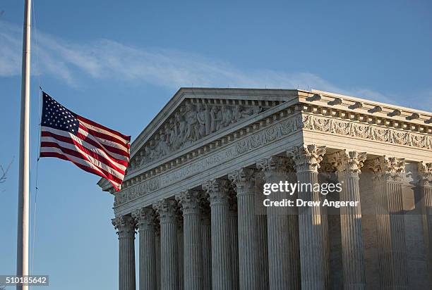 An American flag flies at half mast following the death of Supreme Court Justice Antonin Scalia at the U.S. Supreme Court, February 14, 2016 in...