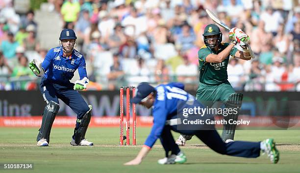 David Wiese of South Africa hits past England captain Eoin Morgan during the 5th Momentum ODI match between South Africa and England at Newlands...