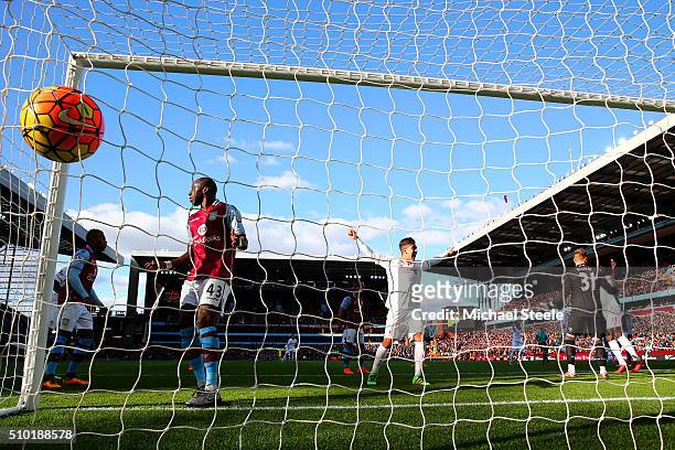 James Milner of Liverpool scores his team's second goal past Mark Bunn of Aston Villa during the Barclays Premier League match between Aston Villa...