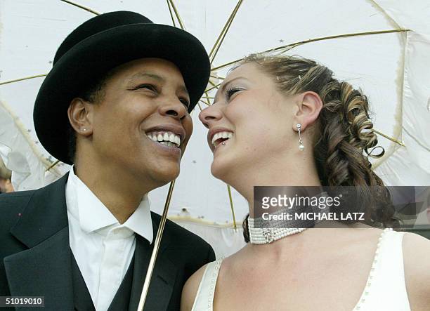 Singer-songwriter Marla Glen and her partner Sabrina Conley laugh after their wedding at the town hall of the southern town of Heilbronn, 02 July...