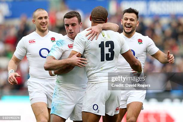 Jonathan Joseph of England is congratulated by teammates Mike Brown , George Ford and Danny Care of England after scoring his team's third try during...