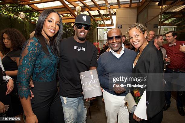 Kelly Rowland, Sean Combs, LA Reid and Erica Reid pose for a photo at the LA Reid "Sing To Me" Pre-Grammy Brunch at Hinoki & The Bird on February 13,...