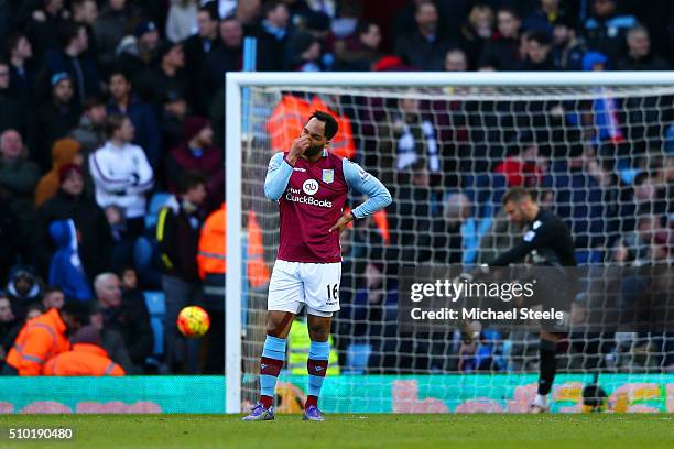 Joleon Lescott of Aston Villa shows his dejection as Mark Bunn kicks the ball away in frustration during the Barclays Premier League match between...