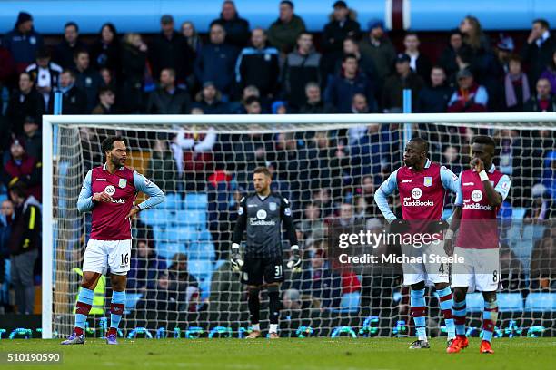 Joleon Lescott, Mark Bunn, Aly Cissokho and Idrissa Gana of Aston Villa show their dejection during the Barclays Premier League match between Aston...