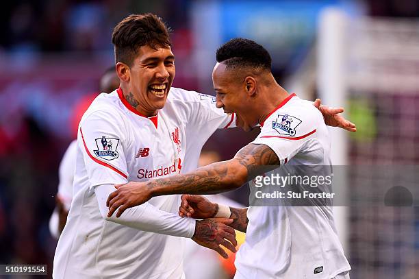 Nathaniel Clyne of Liverpool celebrates with team-mate Roberto Firmino after scoring his team's fifth goal during the Barclays Premier League match...