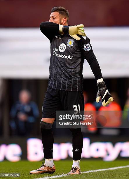 Mark Bunn of Aston Villa reacts after conceding a goal during the Barclays Premier League match between Aston Villa and Liverpool at Villa Park on...