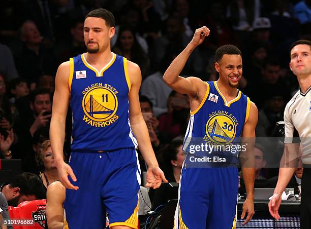 Klay Thompson and Stephen Curry of the Golden State Warriors react in the Foot Locker Three-Point Contest during NBA All-Star Weekend 2016 at Air...