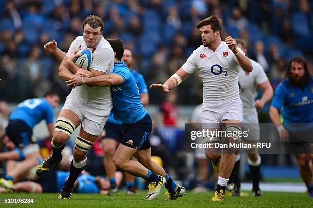 Joe Launchbury of England gets support from Jack Clifford of England as he is tackled by Andrea Pratichetti of Italy during the RBS Six Nations match...