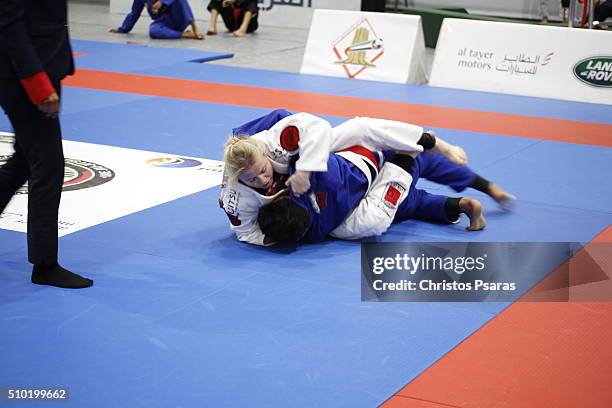 Amal Sheikh of Marocco competes with Storm Lane of Great Britain in women's white belt open weight semi-finals during Sharjah Jiu-Jitsu Open...