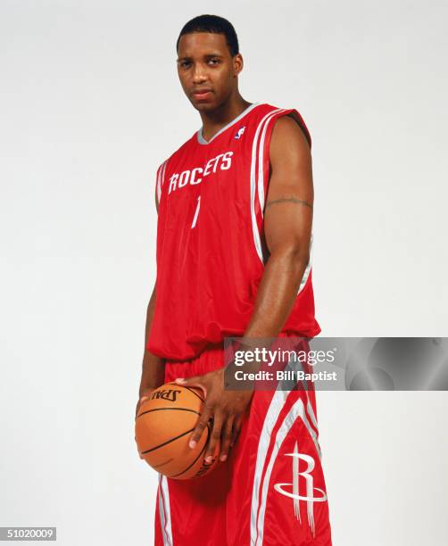 Tracy McGrady of the Houston Rockets poses for a portrait on June 30, 2004 at Toyota Center in Houston, Texas. NOTE TO USER: User expressly...