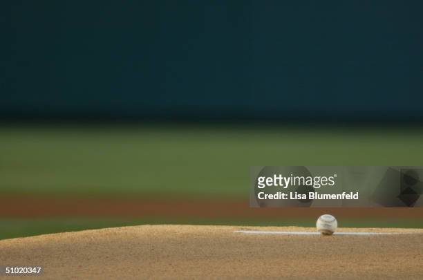 The baseball rests on the pitcher's mound during the game between the Cleveland Indians and the Anaheim Angels at Angel Stadium on June 3, 2004 in...