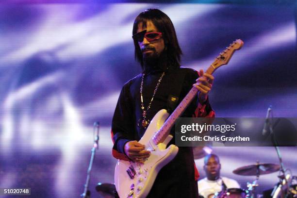 American musician Prince wears a wig, sunglasses, and a false goatee as a disguise with the opening act of The 10th Anniversary Essence Music...