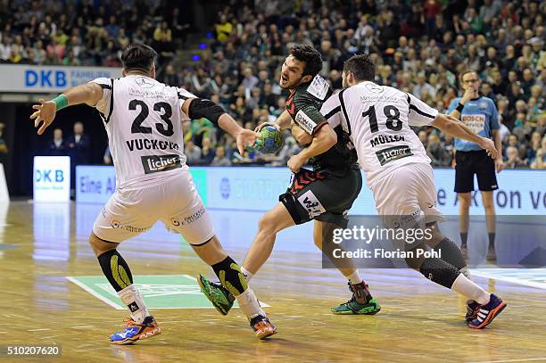 Petar Nenadic of Fuechse Berlin, Nenad Vuckovic of MT Melsungen and Philipp Mueller of MT Melsungen during the game between Fuechse Berlin and MT...