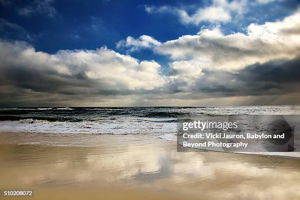 sky, clouds and water reflections at robert moses state park - robert moses bridge stockfoto's en -beelden