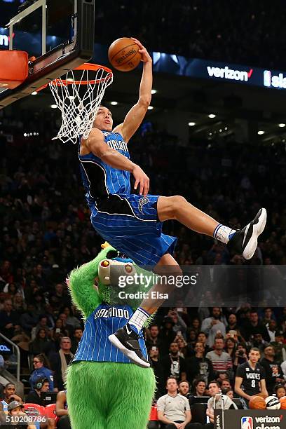 Aaron Gordon of the Orlando Magic dunks over Stuff the Orlando Magic mascot in the Verizon Slam Dunk Contest during NBA All-Star Weekend 2016 at Air...