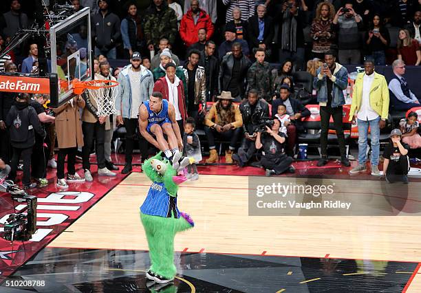 Aaron Gordon of the Orlando Magic dunks over Stuff the Orlando Magic mascot in the Verizon Slam Dunk Contest during NBA All-Star Weekend 2016 at Air...