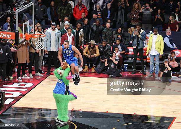 Aaron Gordon of the Orlando Magic dunks over Stuff the Orlando Magic mascot in the Verizon Slam Dunk Contest during NBA All-Star Weekend 2016 at Air...