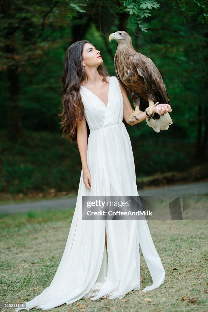 Beautiful girl and her eagle