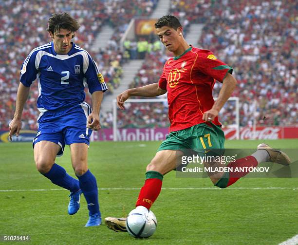 File picture showing Greece's defender Georgios Seitaridis fighting for the ball with Portugal's forward Cristiano Ronaldo 12 June 2004 at Dragao...