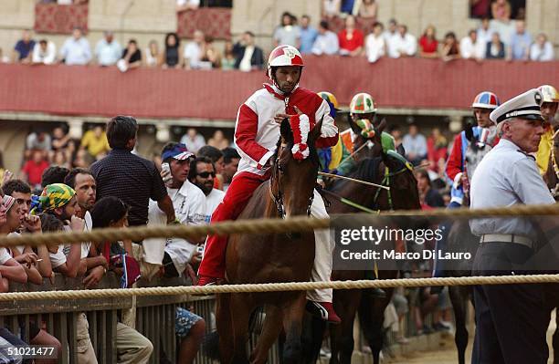 The jockey Alberto Ricceri on his horse Donosu Tou, of Giraffa , one of the seventeen Contrade or neighbourhoods, is seen at the starting line in...